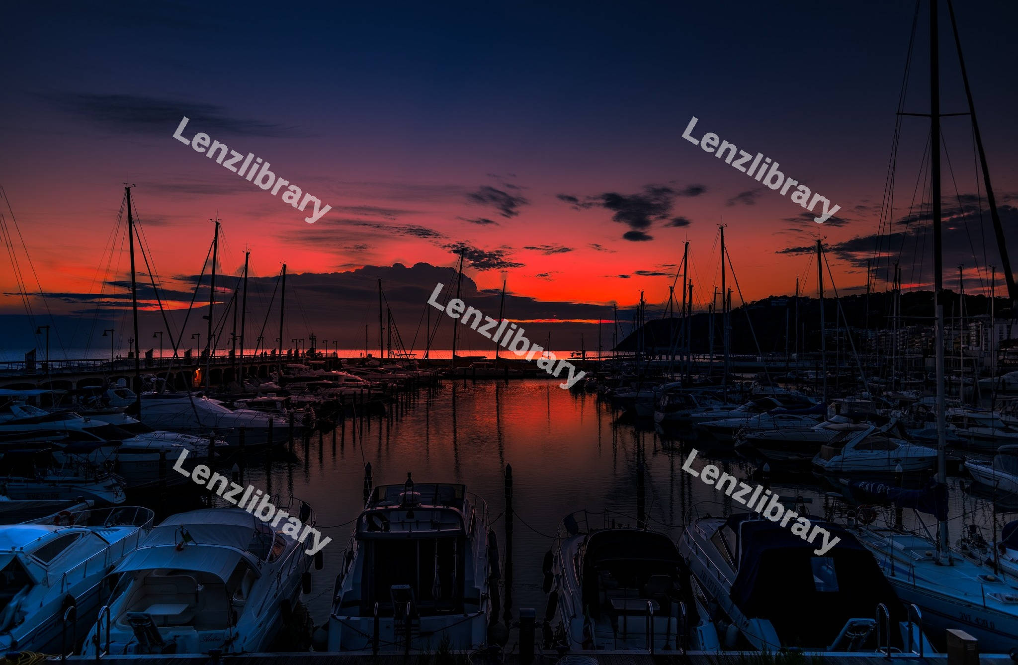 Yacht marina in the sea at sunset